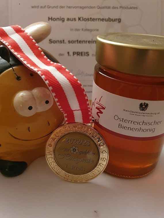 Honigglas mit Medaille